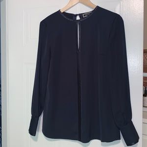 Elegant, long sleeved blouse. Satin trim at cuffs, neckline and key-hole.